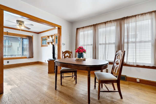 3229 N Oketo Ave, Chicago, IL 60634 - dining space featuring light wood finished floors, baseboards, a ceiling fan, and ornamental molding