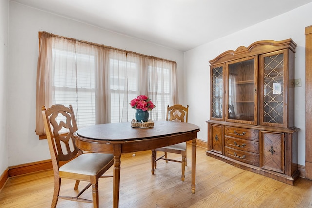 3229 N Oketo Ave, Chicago, IL 60634 - dining space with light wood-style flooring and baseboards
