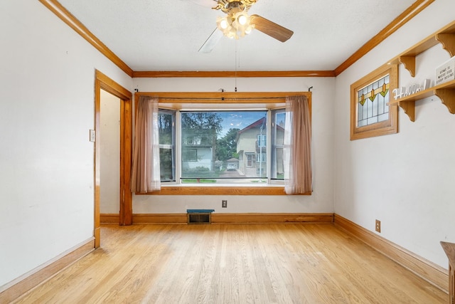 3229 N Oketo Ave, Chicago, IL 60634 - unfurnished room with healthy amount of natural light, ceiling fan, wood finished floors, baseboards, and ornamental molding