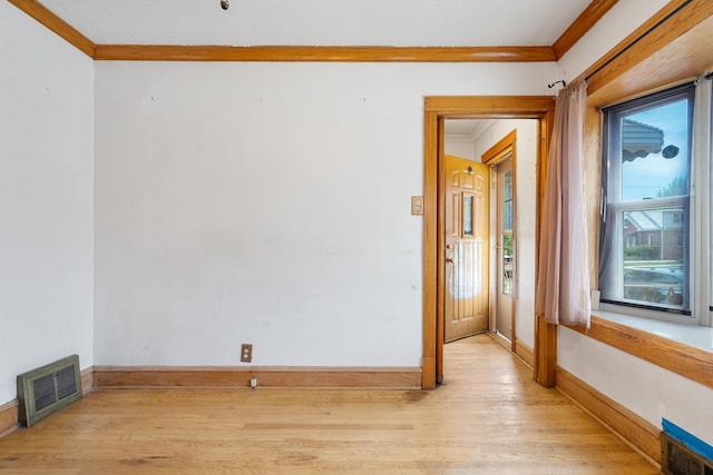 3229 N Oketo Ave, Chicago, IL 60634 - spare room featuring ornamental molding, light wood-style floors, and baseboards