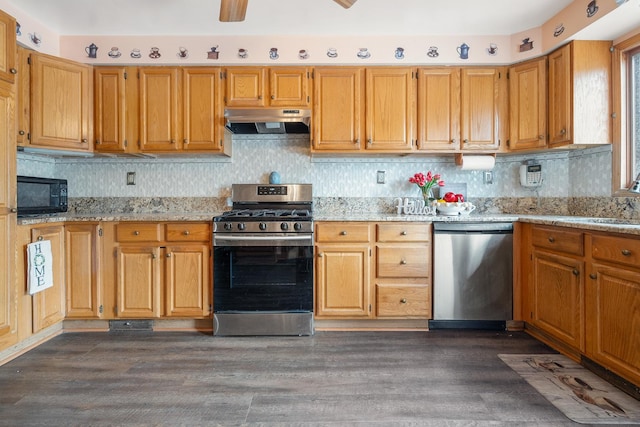 3229 N Oketo Ave, Chicago, IL 60634 - kitchen with stainless steel appliances, under cabinet range hood, dark wood-type flooring, and decorative backsplash