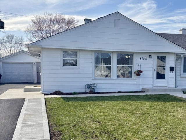 8758 S Corcoran Rd Unit 2, Hometown, IL 60456 - bungalow-style home with driveway, an outbuilding, a front yard, and a detached garage