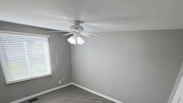 8758 S Corcoran Rd Unit 2, Hometown, IL 60456 - empty room with a ceiling fan, healthy amount of natural light, baseboards, and dark wood-style flooring