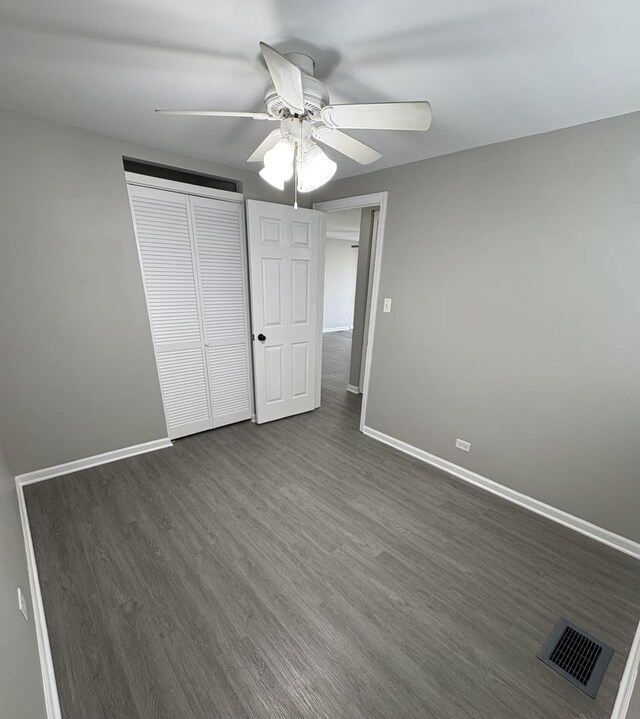 8758 S Corcoran Rd Unit 2, Hometown, IL 60456 - unfurnished bedroom featuring dark wood finished floors, baseboards, and a closet