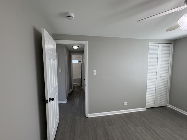 8758 S Corcoran Rd Unit 2, Hometown, IL 60456 - unfurnished bedroom with baseboards, dark wood-type flooring, a ceiling fan, and a closet