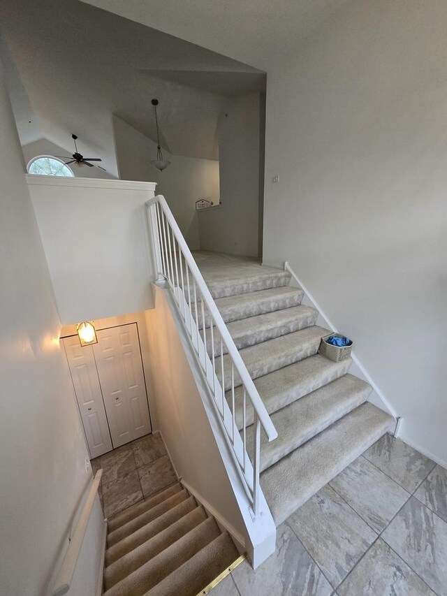 1639 Colfax Ct Unit 3, Bartlett, IL 60103 - stairway featuring ceiling fan, high vaulted ceiling, and baseboards