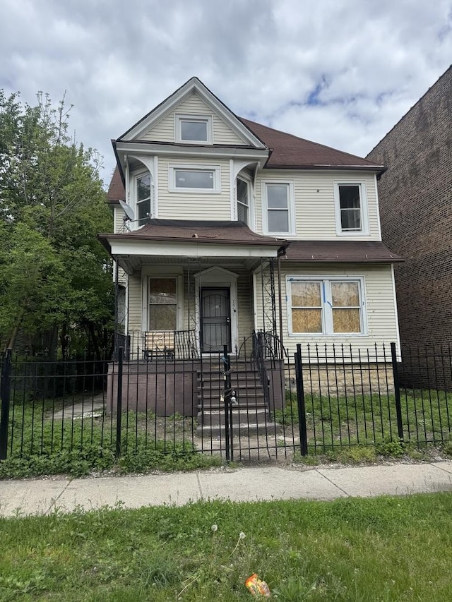 7051 S Princeton Ave, Chicago, IL 60621 - view of front facade with a porch and a fenced front yard