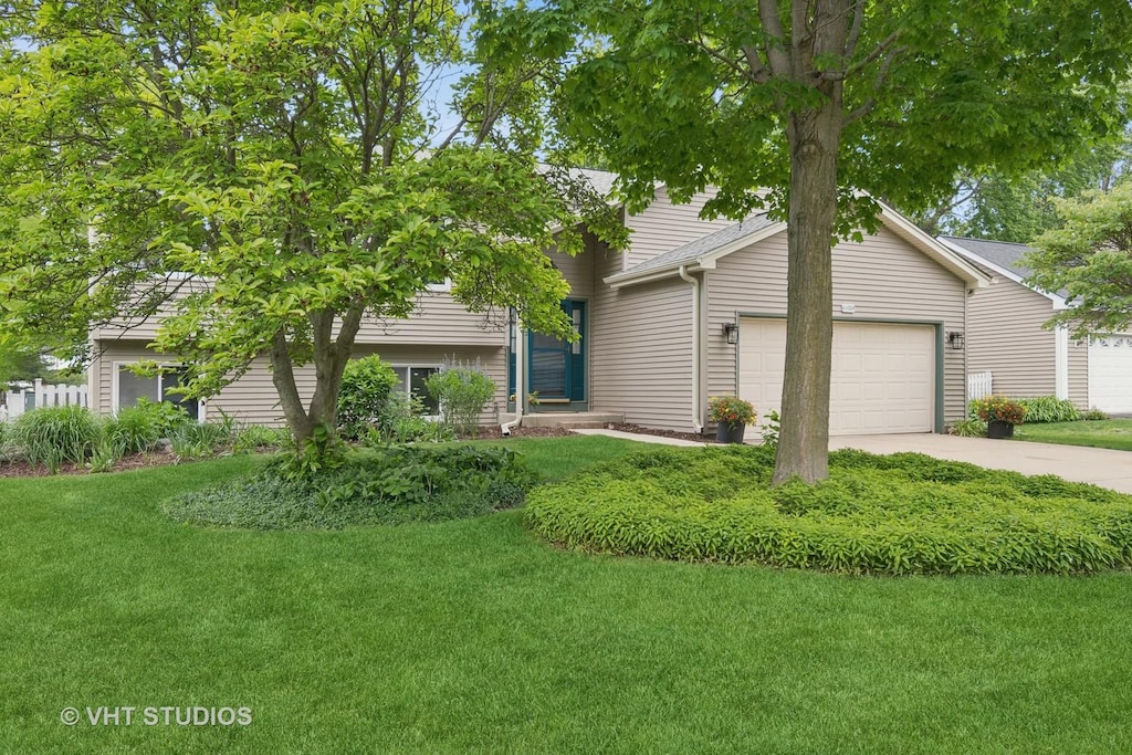 6S024 Westwind Dr, Naperville, IL 60563 - view of front of property featuring an attached garage, a front lawn, and concrete driveway