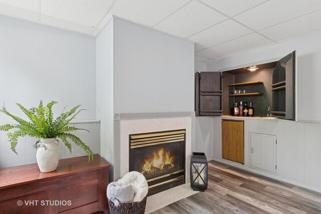 6S024 Westwind Dr, Naperville, IL 60563 - indoor bar with a drop ceiling, wood finished floors, a fireplace, and wainscoting