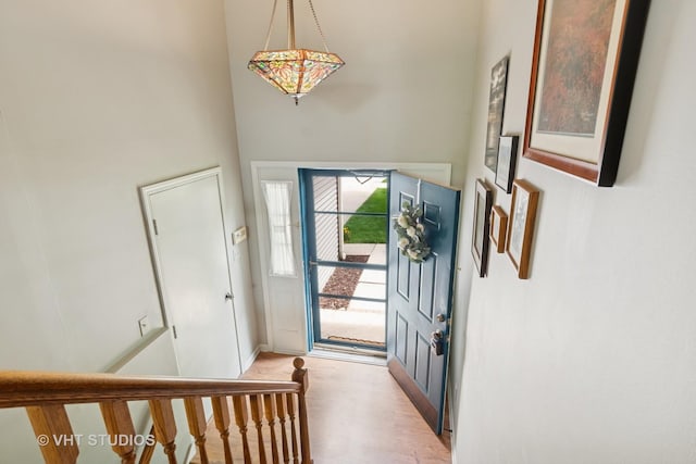 6S024 Westwind Dr, Naperville, IL 60563 - entryway with light wood-style floors, baseboards, and a towering ceiling