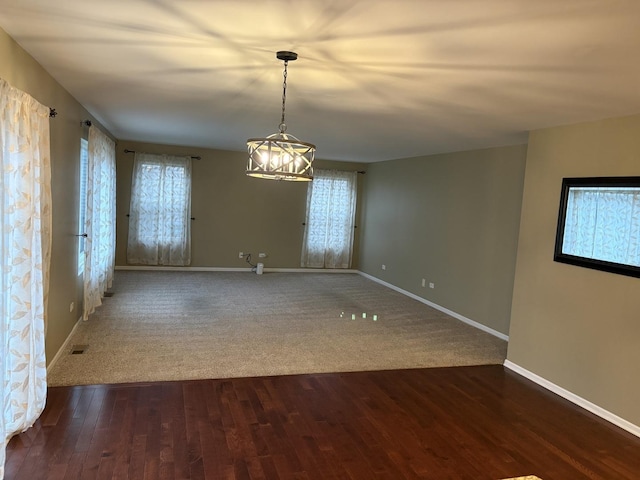 2804 Misty Brook Ln, Joliet, IL 60432 - unfurnished room featuring wood finished floors, baseboards, and a chandelier