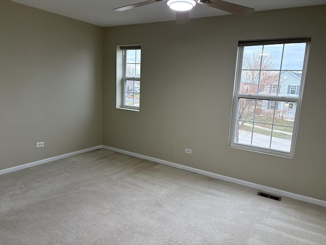 2804 Misty Brook Ln, Joliet, IL 60432 - spare room featuring a ceiling fan, light colored carpet, and baseboards