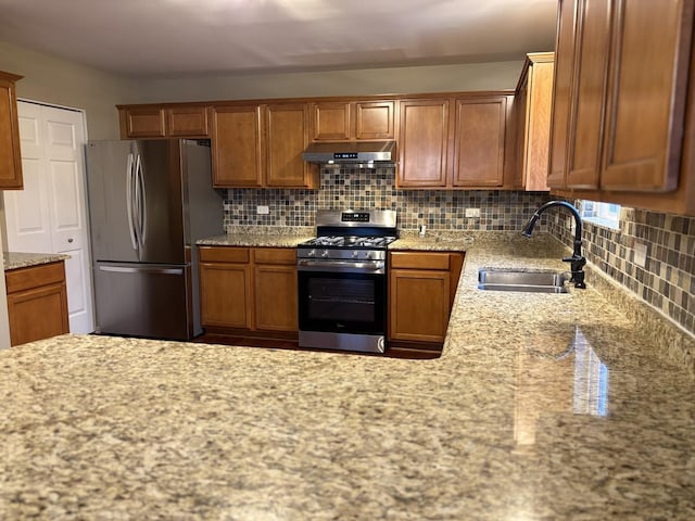 2804 Misty Brook Ln, Joliet, IL 60432 - kitchen with appliances with stainless steel finishes, a sink, under cabinet range hood, decorative backsplash, and brown cabinets