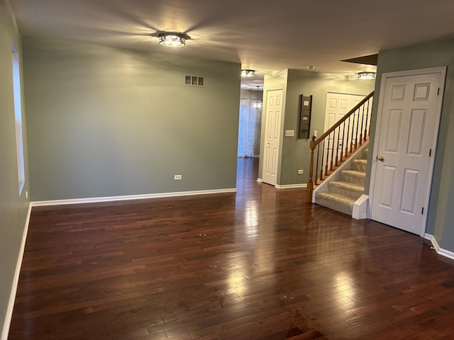 2804 Misty Brook Ln, Joliet, IL 60432 - spare room featuring dark wood-type flooring, baseboards, and stairway