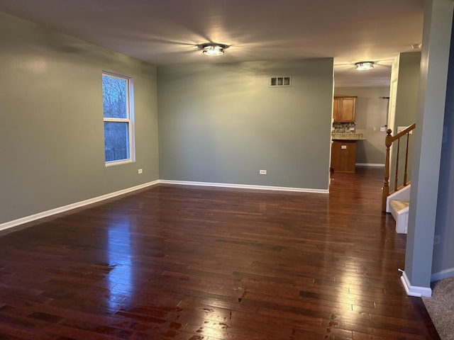 2804 Misty Brook Ln, Joliet, IL 60432 - unfurnished room featuring dark wood-style flooring, stairs, and baseboards