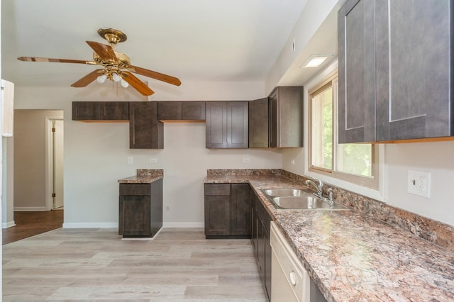948 Carney Ave, Waukegan, IL 60085 - kitchen featuring a sink, light wood-style floors, dark brown cabinets, and a ceiling fan