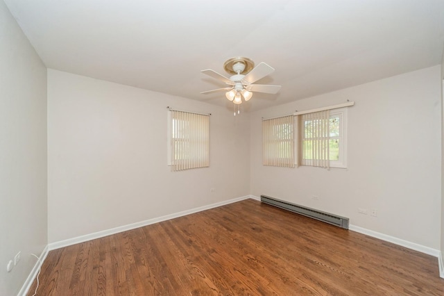 948 Carney Ave, Waukegan, IL 60085 - empty room with baseboard heating, wood finished floors, ceiling fan, and baseboards