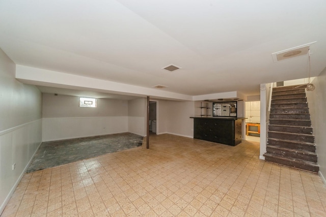 948 Carney Ave, Waukegan, IL 60085 - below grade area with stairway, wainscoting, and light floors