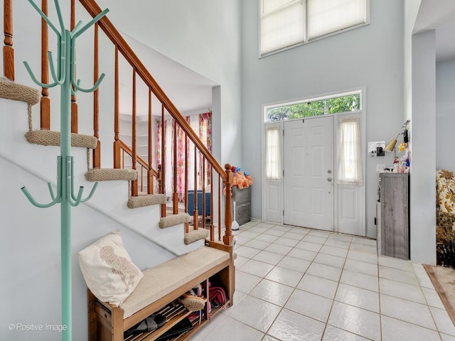 1465 Teal Ct, Hoffman Estates, IL 60192 - entrance foyer featuring a towering ceiling, tile patterned floors, and stairs