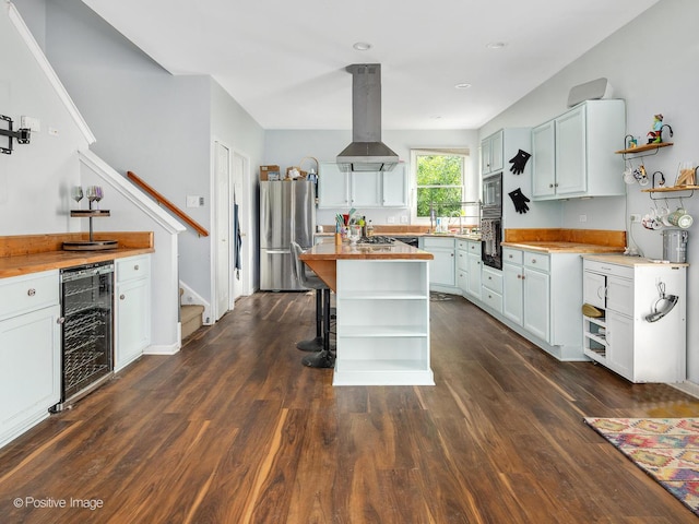 1465 Teal Ct, Hoffman Estates, IL 60192 - kitchen with beverage cooler, appliances with stainless steel finishes, open shelves, island exhaust hood, and butcher block counters