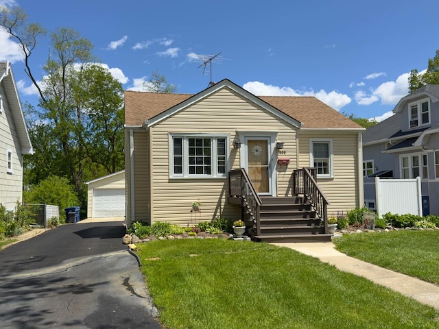 505 S Oakland Ave, Villa Park, IL 60181 - bungalow-style home featuring an outdoor structure, a garage, a shingled roof, and a front yard