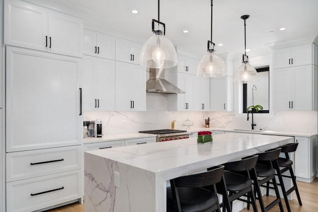 1719 N Burling St Unit 2S, Chicago, IL 60614 - kitchen featuring a sink, a kitchen island, white cabinetry, backsplash, and recessed lighting
