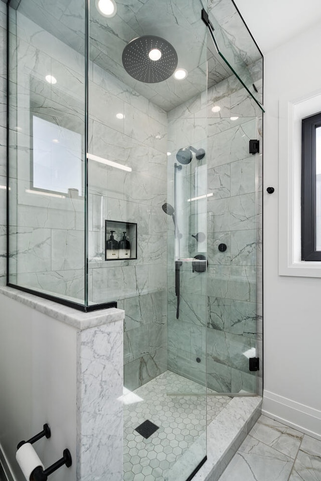 1719 N Burling St Unit 2S, Chicago, IL 60614 - full bathroom featuring a stall shower, marble look tile flooring, and baseboards
