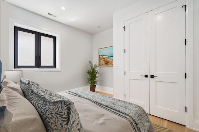 1719 N Burling St Unit 2S, Chicago, IL 60614 - bedroom with light wood finished floors, baseboards, recessed lighting, and a closet