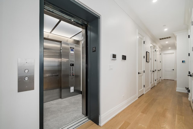 1719 N Burling St Unit 2S, Chicago, IL 60614 - corridor featuring elevator, light wood finished floors, recessed lighting, and baseboards