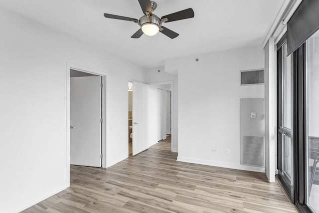 210 S Desplaines St Unit 1102, Chicago, IL 60661 - empty room featuring a ceiling fan, light wood-style flooring, baseboards, and a heating unit