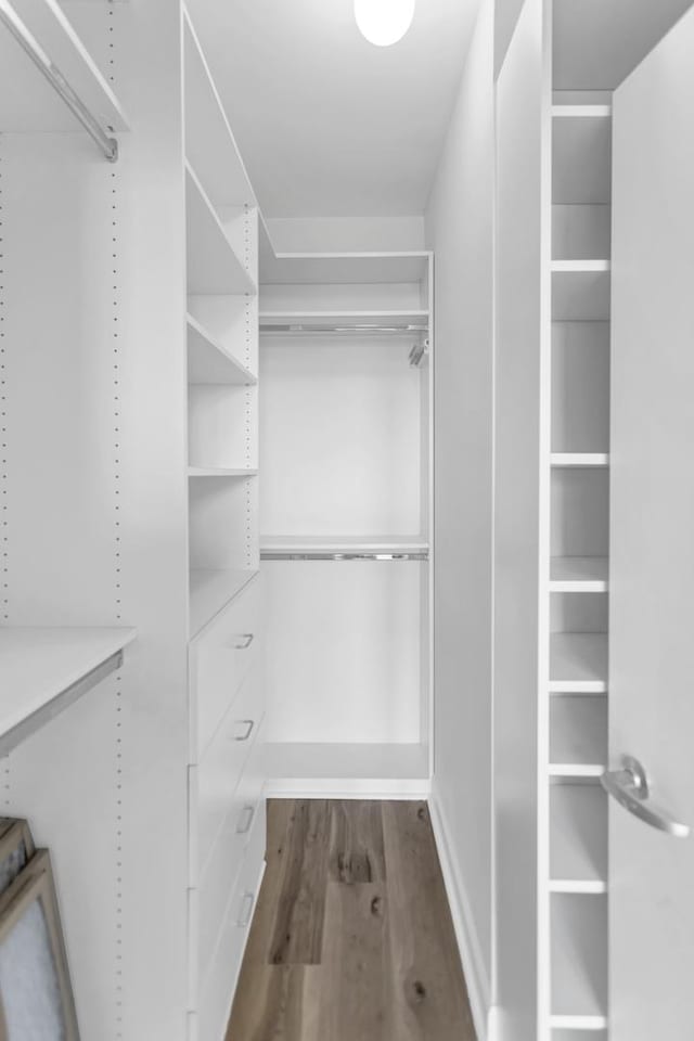 210 S Desplaines St Unit 1102, Chicago, IL 60661 - walk in closet featuring dark wood finished floors