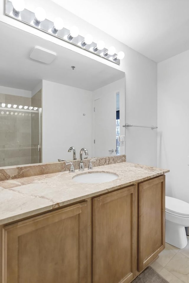 210 S Desplaines St Unit 1102, Chicago, IL 60661 - bathroom with vanity, toilet, tiled shower, and tile patterned flooring
