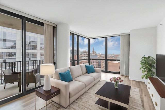 210 S Desplaines St Unit 1102, Chicago, IL 60661 - living area featuring expansive windows, wood finished floors, and baseboards