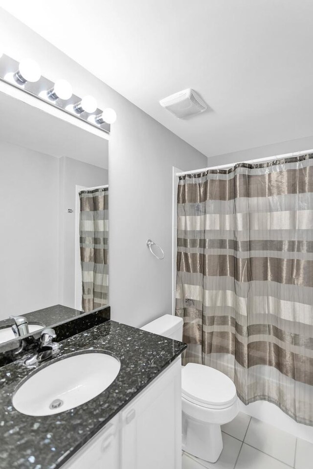 210 S Desplaines St Unit 1102, Chicago, IL 60661 - bathroom featuring vanity, toilet, and tile patterned floors