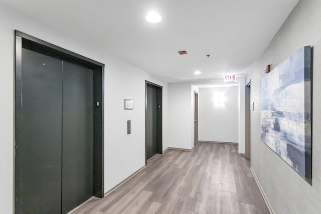 210 S Desplaines St Unit 1102, Chicago, IL 60661 - corridor featuring elevator, light wood-style floors, and recessed lighting