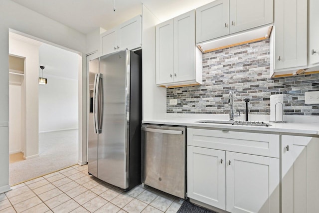 950 E Wilmette Rd Unit 410, Palatine, IL 60067 - kitchen with stainless steel appliances, a sink, light countertops, and tasteful backsplash