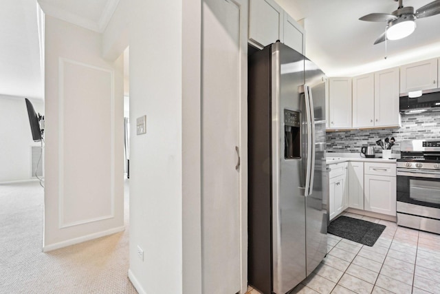 950 E Wilmette Rd Unit 410, Palatine, IL 60067 - kitchen featuring stainless steel appliances, ventilation hood, ceiling fan, light countertops, and tasteful backsplash