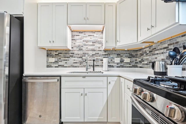 950 E Wilmette Rd Unit 410, Palatine, IL 60067 - kitchen featuring appliances with stainless steel finishes, a sink, light countertops, and tasteful backsplash