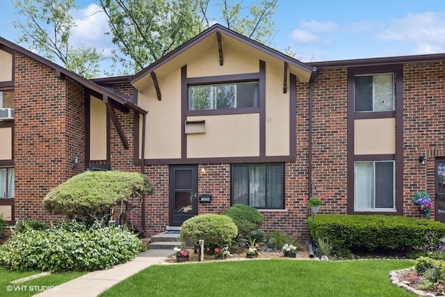 1S155 Danby St, Villa Park, IL 60181 - view of front of property with stucco siding, brick siding, and a front yard