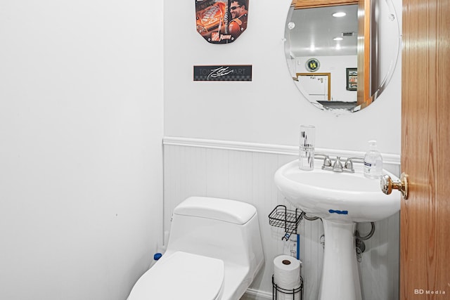 9039 S Central Ave, Oak Lawn, IL 60453 - half bathroom with a wainscoted wall and toilet
