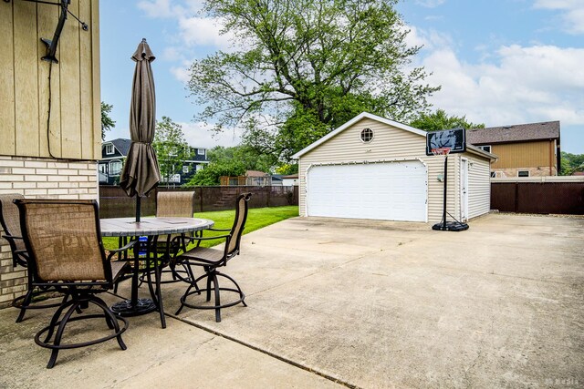 9039 S Central Ave, Oak Lawn, IL 60453 - view of patio featuring an outbuilding, a garage, and outdoor dining space