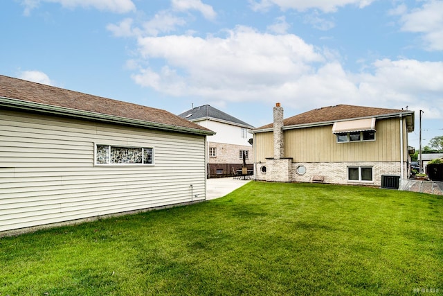 9039 S Central Ave, Oak Lawn, IL 60453 - back of house with central AC, a patio area, and a chimney
