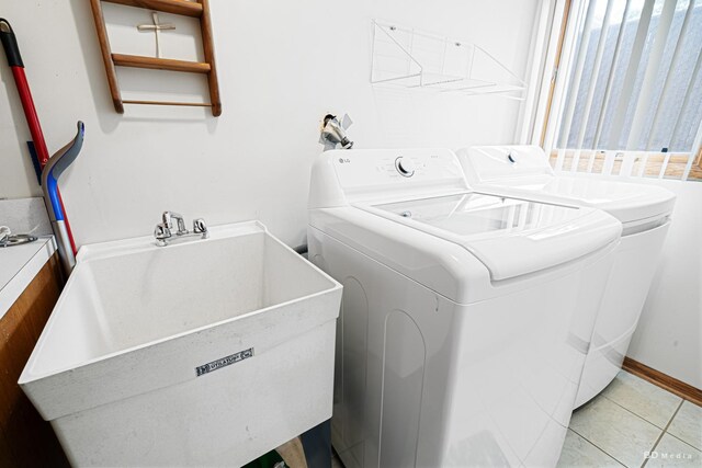 9039 S Central Ave, Oak Lawn, IL 60453 - laundry room featuring washing machine and dryer and light tile patterned floors