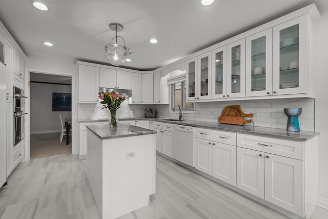 1682 Cavell Ave, Highland Park, IL 60035 - kitchen featuring dishwasher, a sink, white cabinetry, and recessed lighting