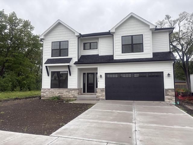 154 Pine Ln, Wood Dale, IL 60191 - view of front of property featuring stone siding, driveway, and an attached garage