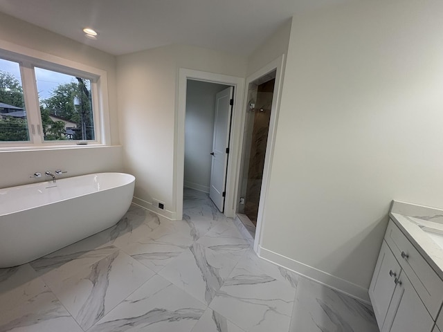 154 Pine Ln, Wood Dale, IL 60191 - bathroom with baseboards, a shower stall, a freestanding tub, vanity, and recessed lighting