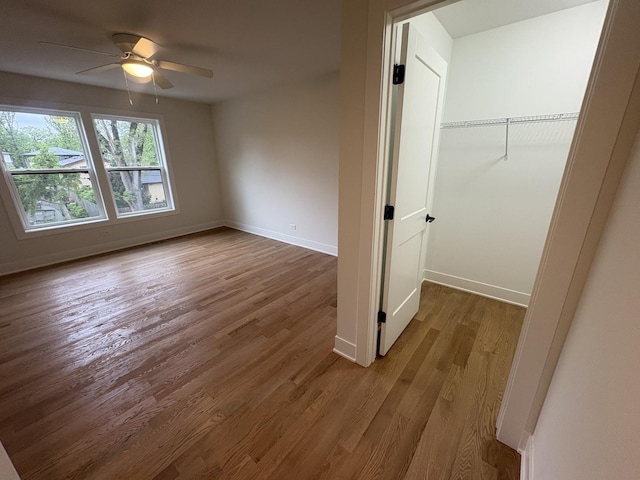 154 Pine Ln, Wood Dale, IL 60191 - unfurnished bedroom with wood finished floors, baseboards, ceiling fan, and a closet
