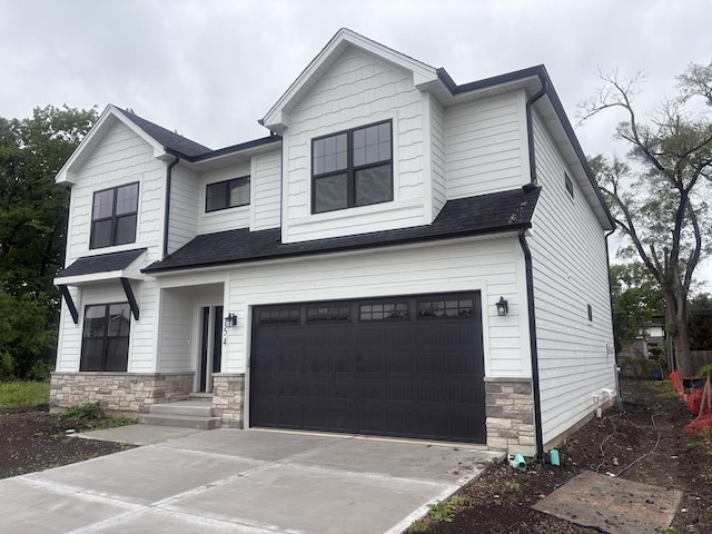 154 Pine Ln, Wood Dale, IL 60191 - view of front of home featuring stone siding, an attached garage, driveway, and a shingled roof