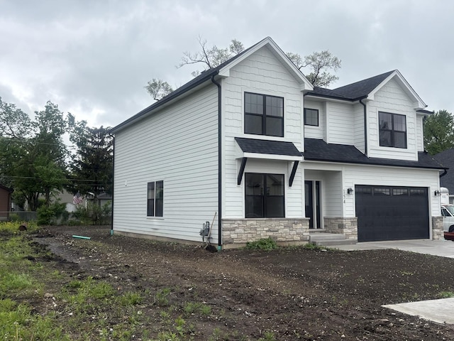 154 Pine Ln, Wood Dale, IL 60191 - view of front of home with an attached garage, concrete driveway, and roof with shingles