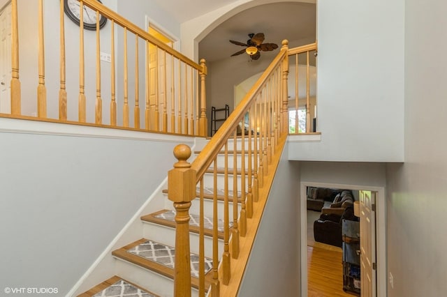 1040 Fairway Dr, Fox Lake, IL 60020 - stairway with a ceiling fan, wood finished floors, and arched walkways